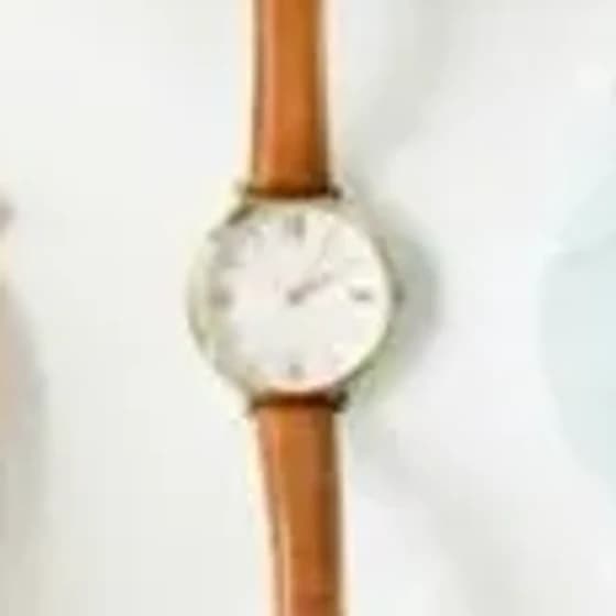 The watch in the uploaded flat lay